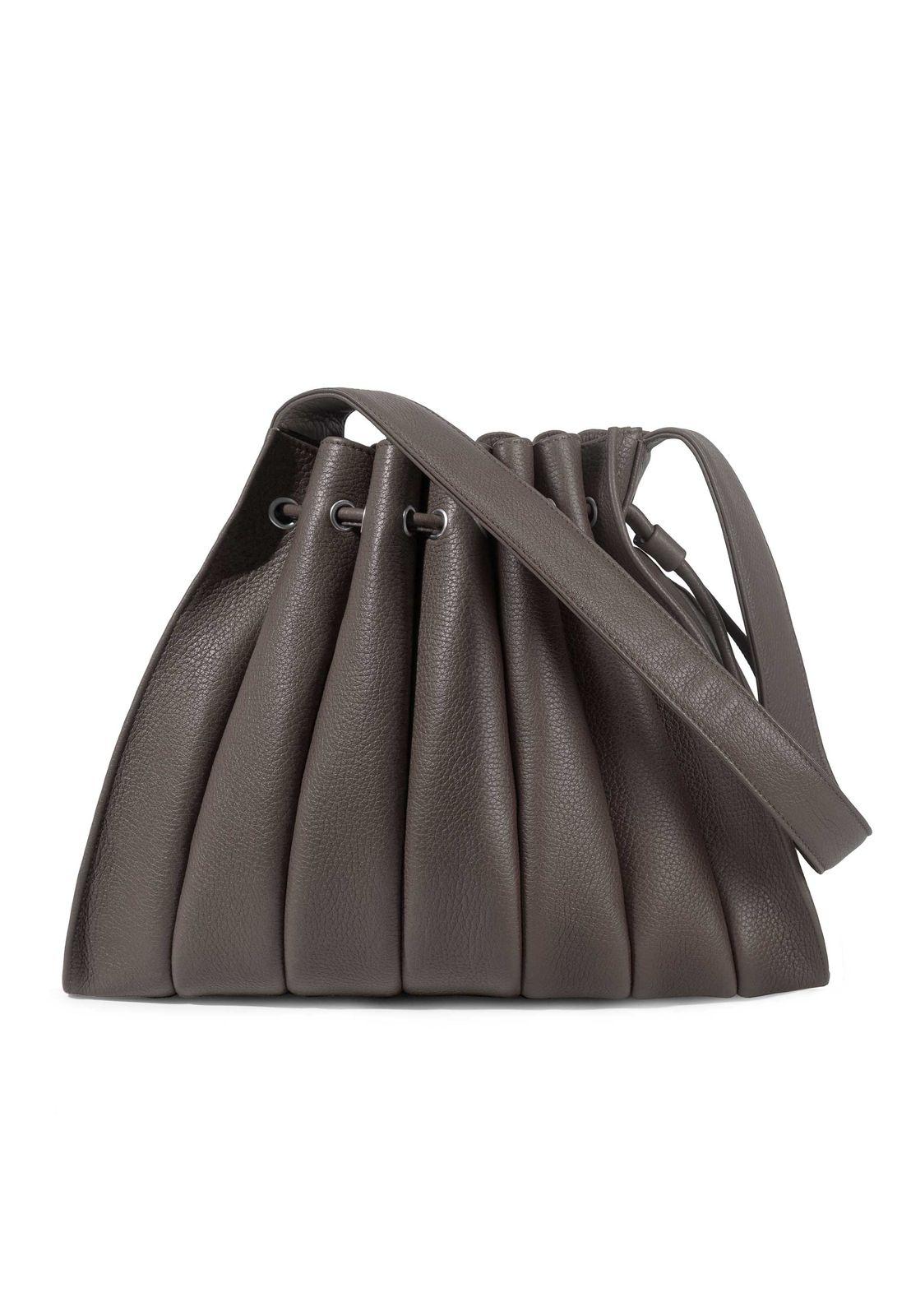 a gray handbag with a long strap