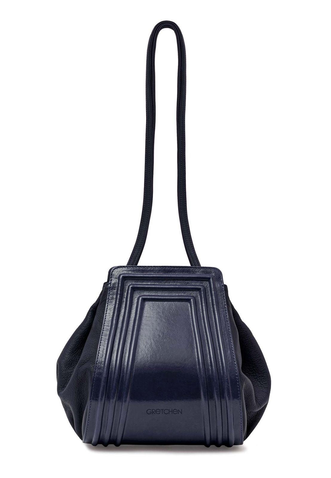 a blue handbag with a black strap