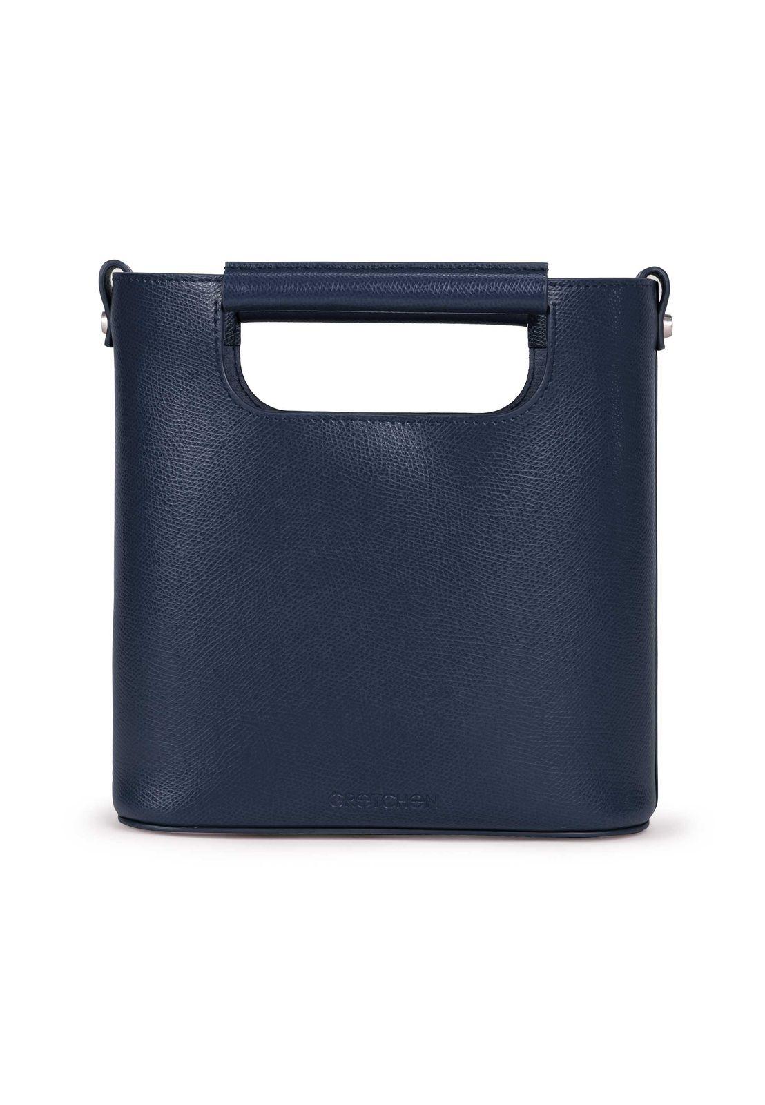 a blue leather bag with a handle