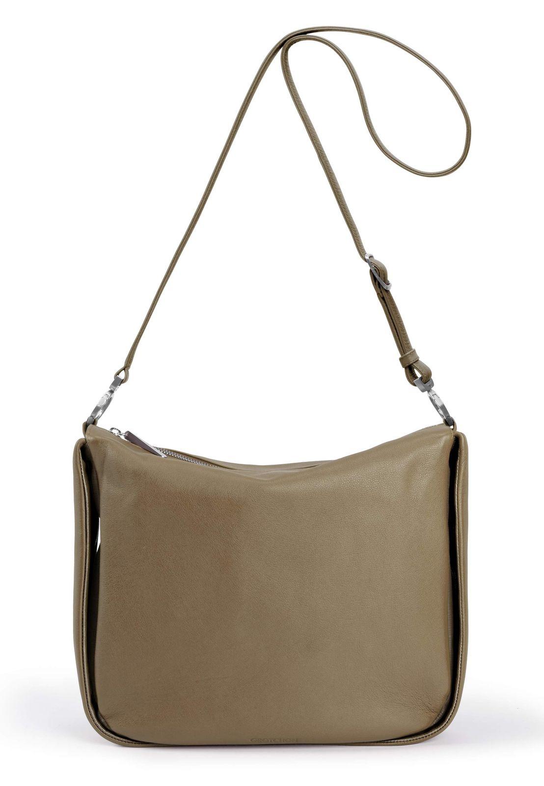 a beige leather purse with a long strap