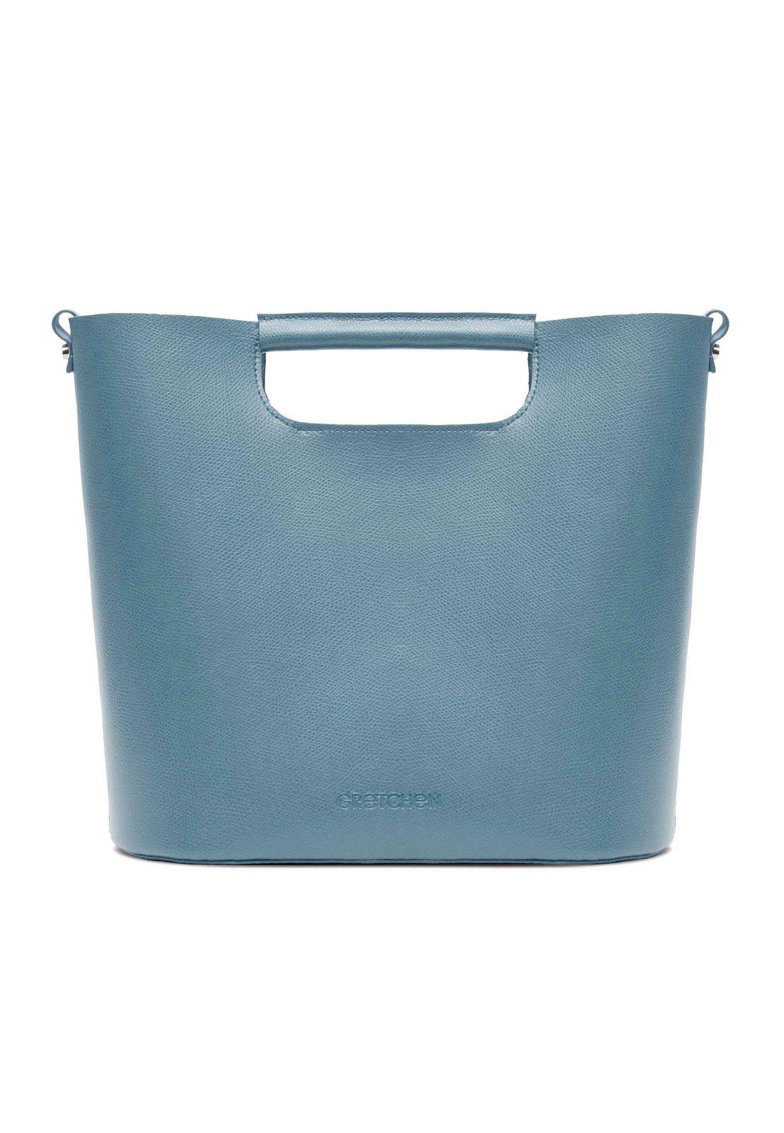 a blue leather bag with a handle
