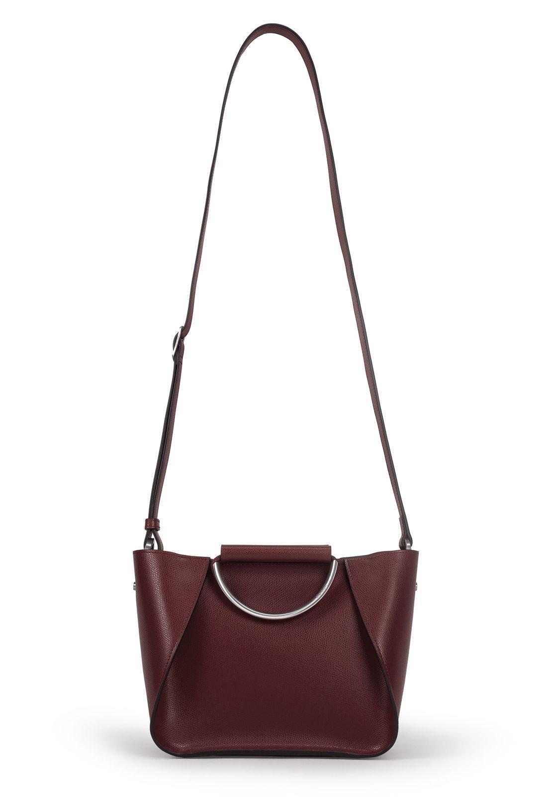 a red handbag with a metal handle