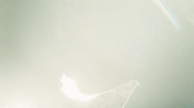 a blurry photo of a person holding a cell phone