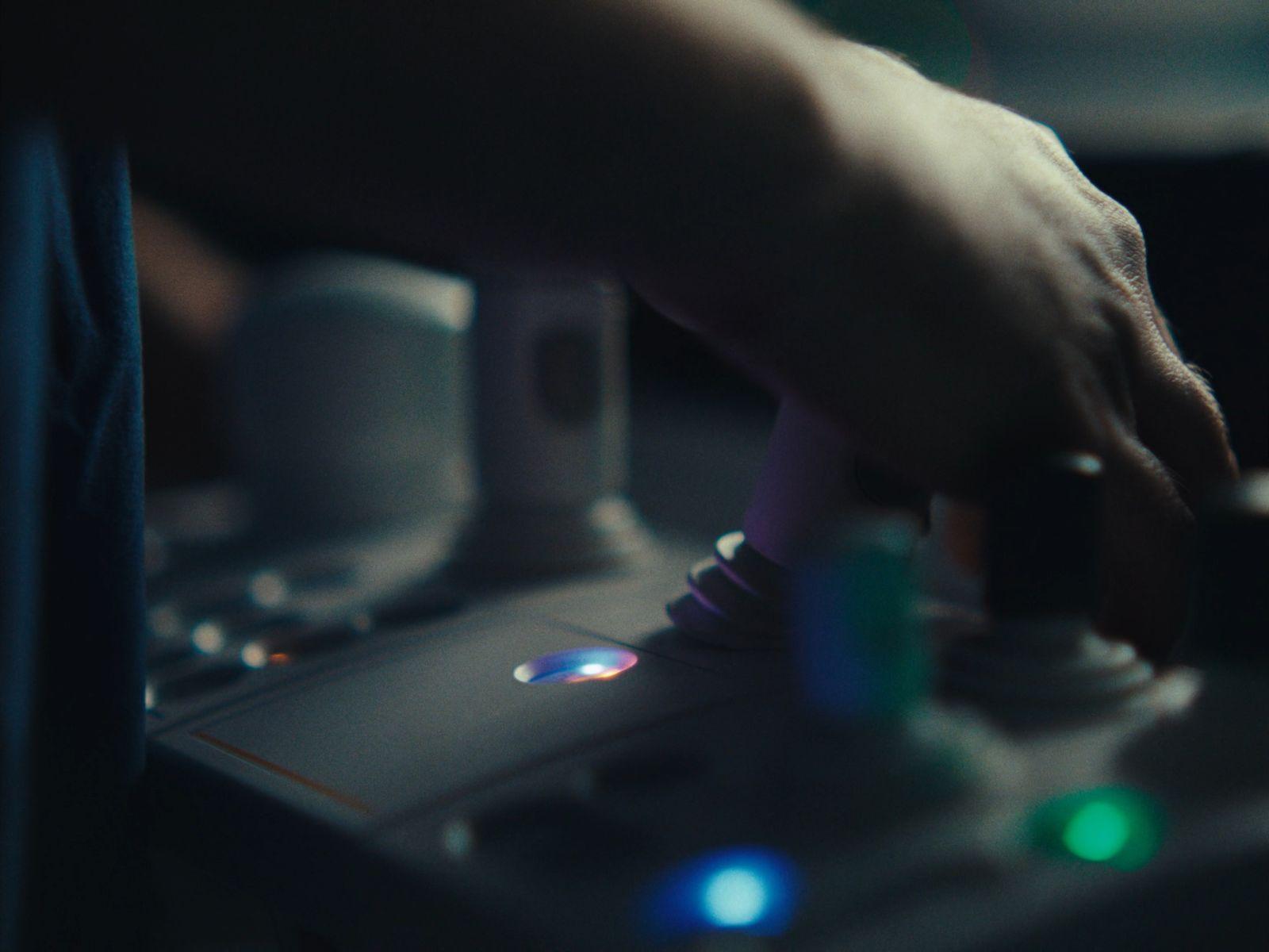 a close up of a person's hand on a controller