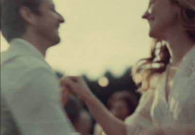 a man and a woman are holding hands