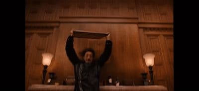 a man holding a box above his head