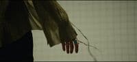a person's hand with a ring on it
