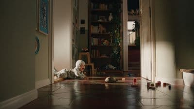 a child laying on the floor in a house