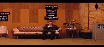 a man sitting on a couch in a room