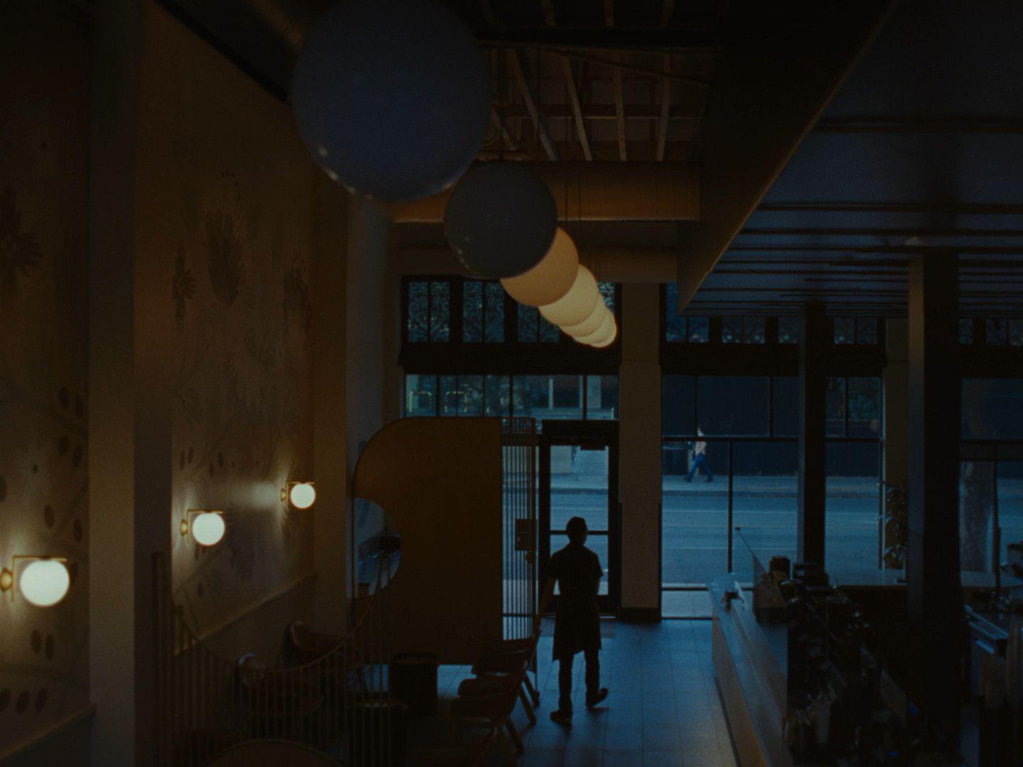 a person standing in a dimly lit room