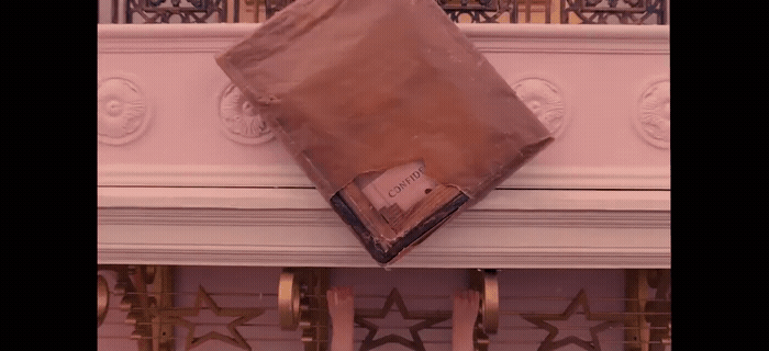 a brown bag sitting on top of a white mantle