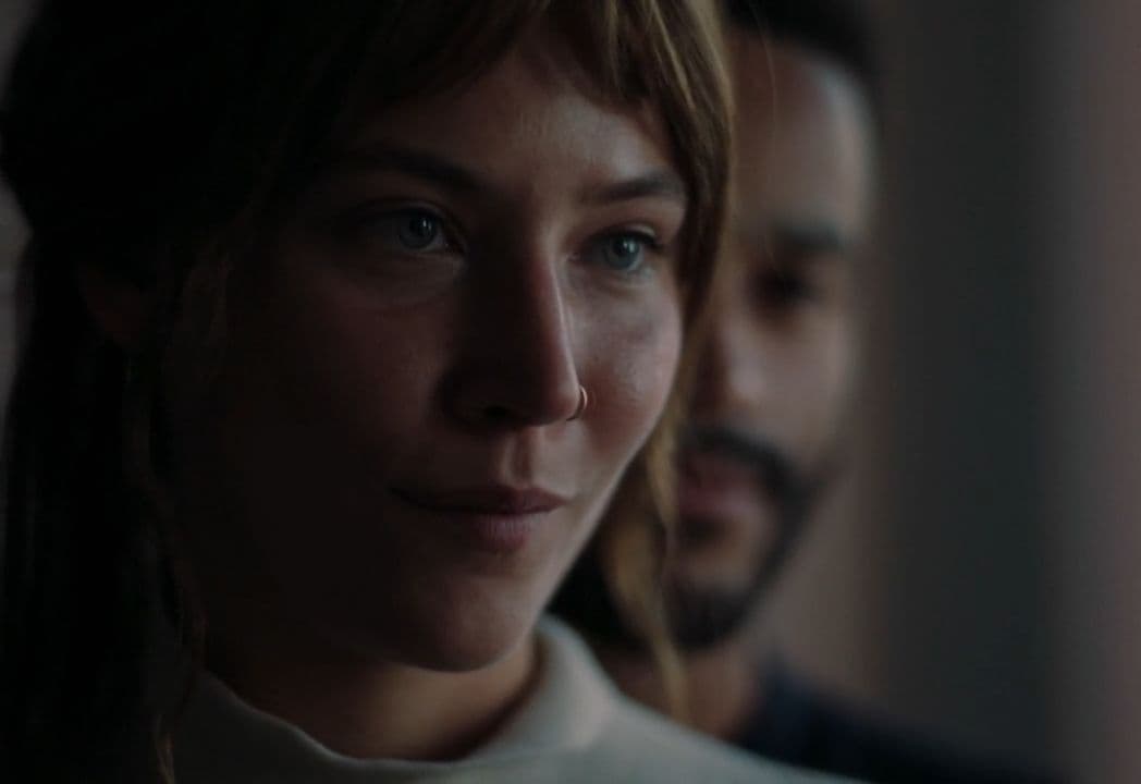 a close up of a person wearing a white shirt