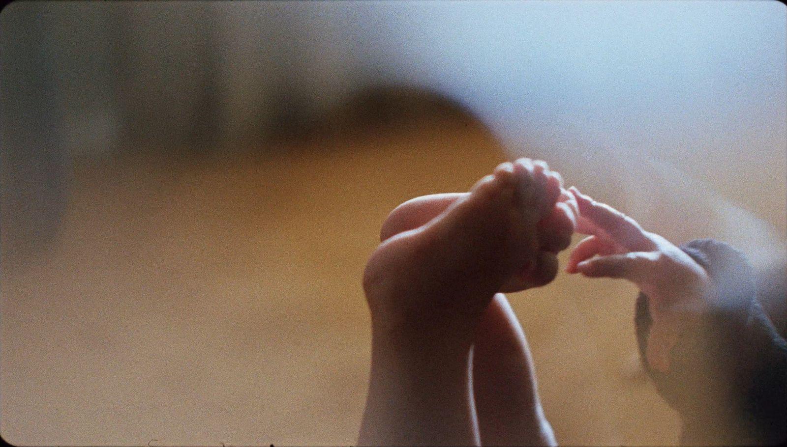 a couple of hands reaching for something in the air
