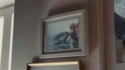 a couple of pictures hanging on the side of a wall