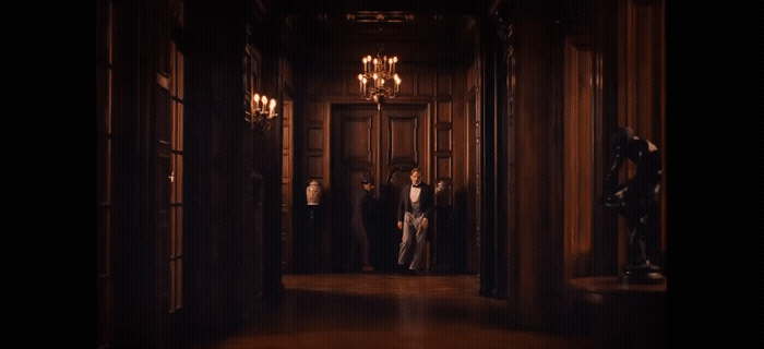 a group of people standing in a hallway