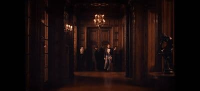 a group of people standing in a hallway