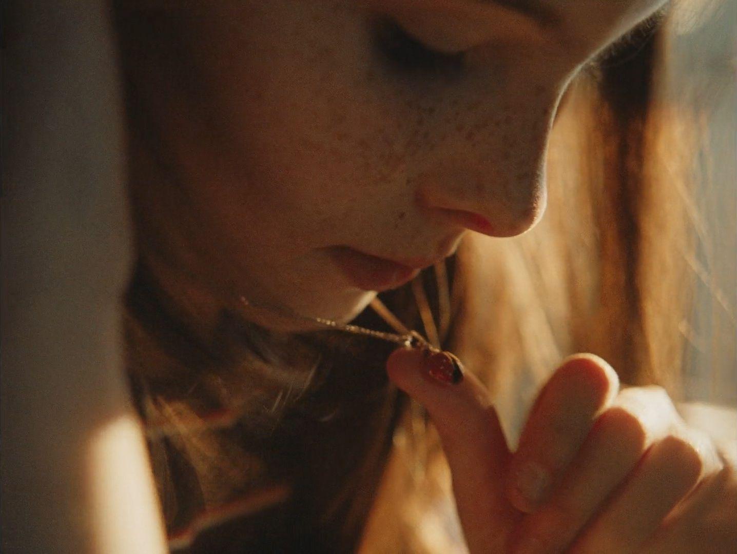 a close up of a person holding something in their hand