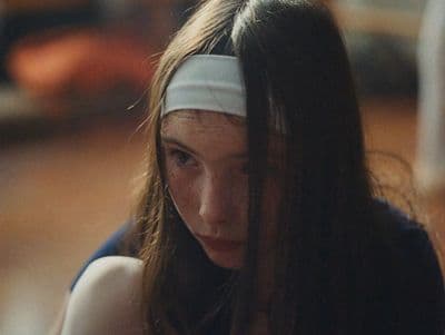 a woman with a blindfold around her head