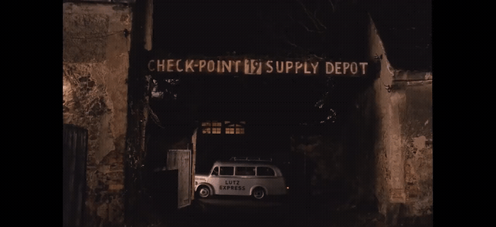 a white van is parked in a dark tunnel
