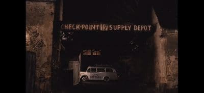 a white van is parked in a dark tunnel