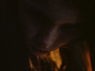 a close up of a person's face in the dark