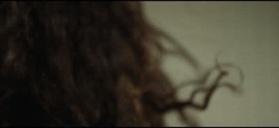 a blurry photo of a woman's hair