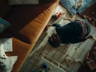a child is playing with toys on the floor