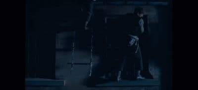 a man standing on a step in the dark