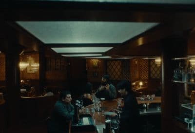 a group of people sitting at a table in a restaurant