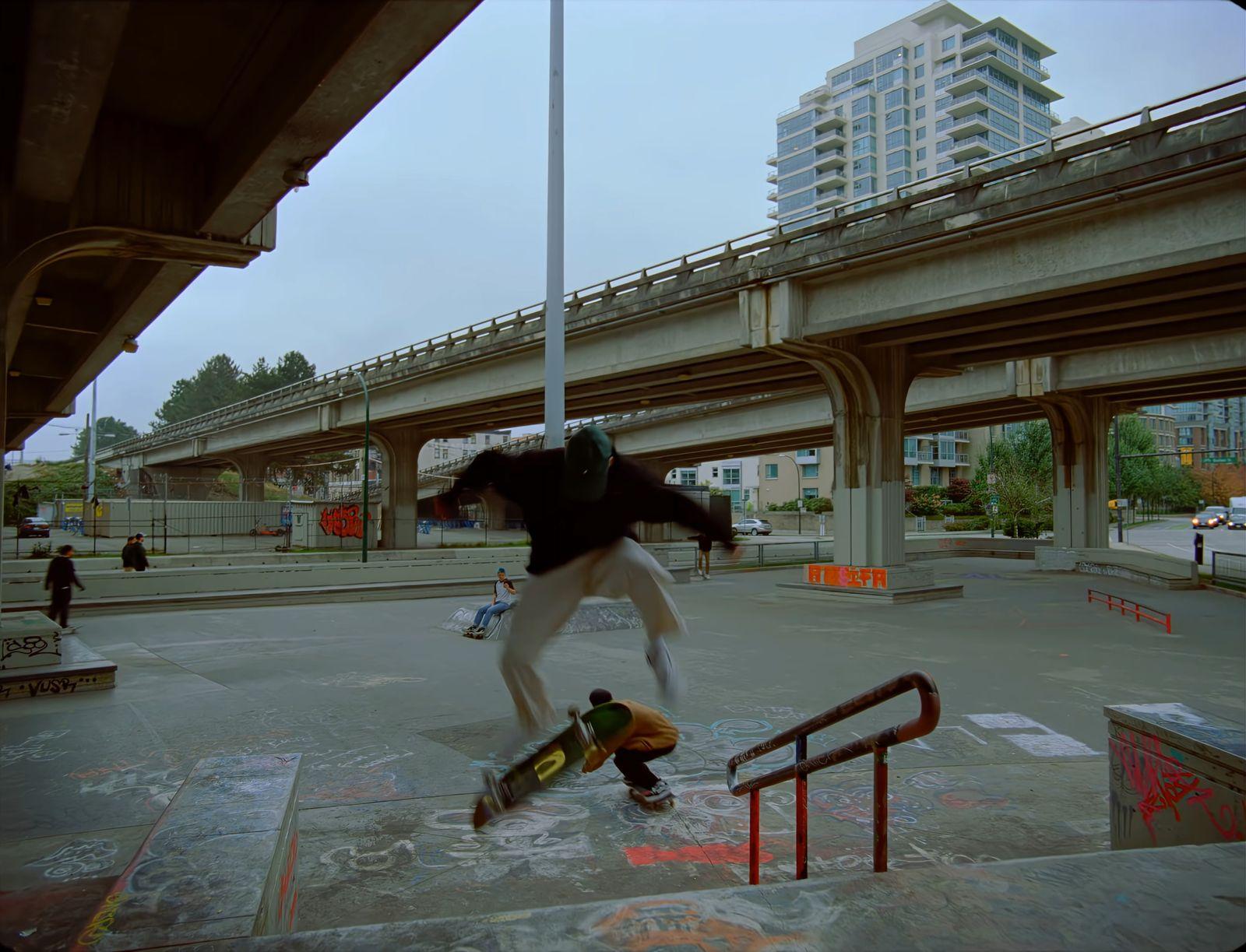 a man riding a skateboard up the side of a ramp