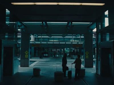 a couple of people that are standing in a building