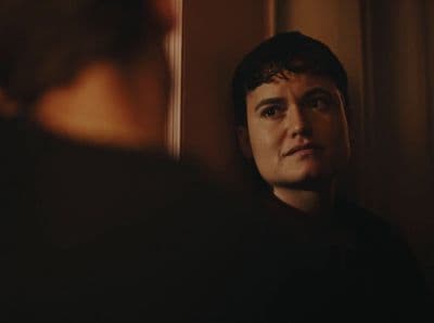 a man looking at himself in the mirror