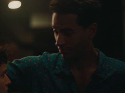 a man and a woman are staring at each other