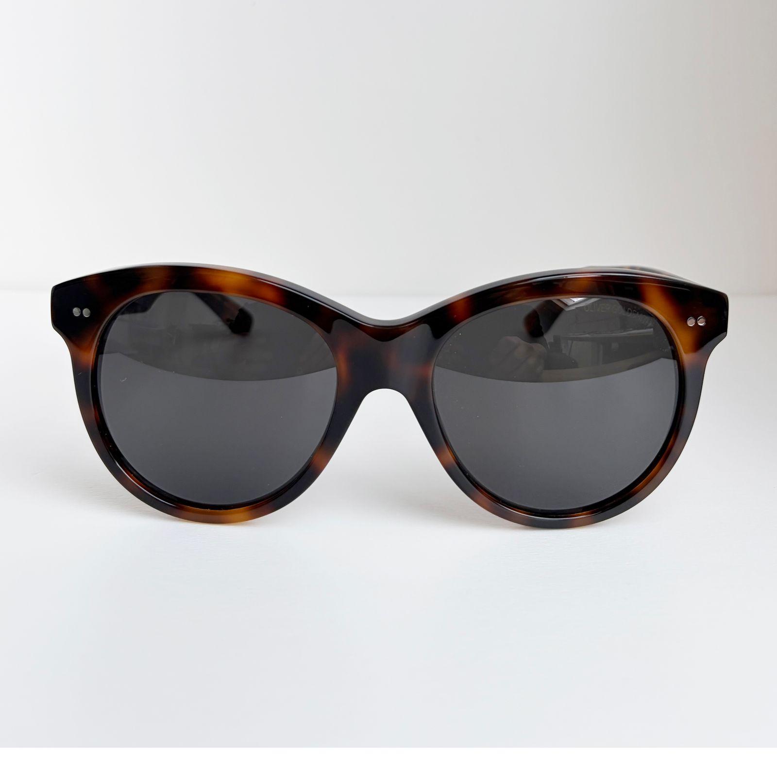 a pair of sunglasses sitting on top of a table