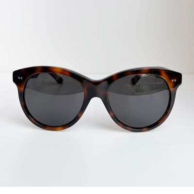 a pair of sunglasses sitting on top of a table