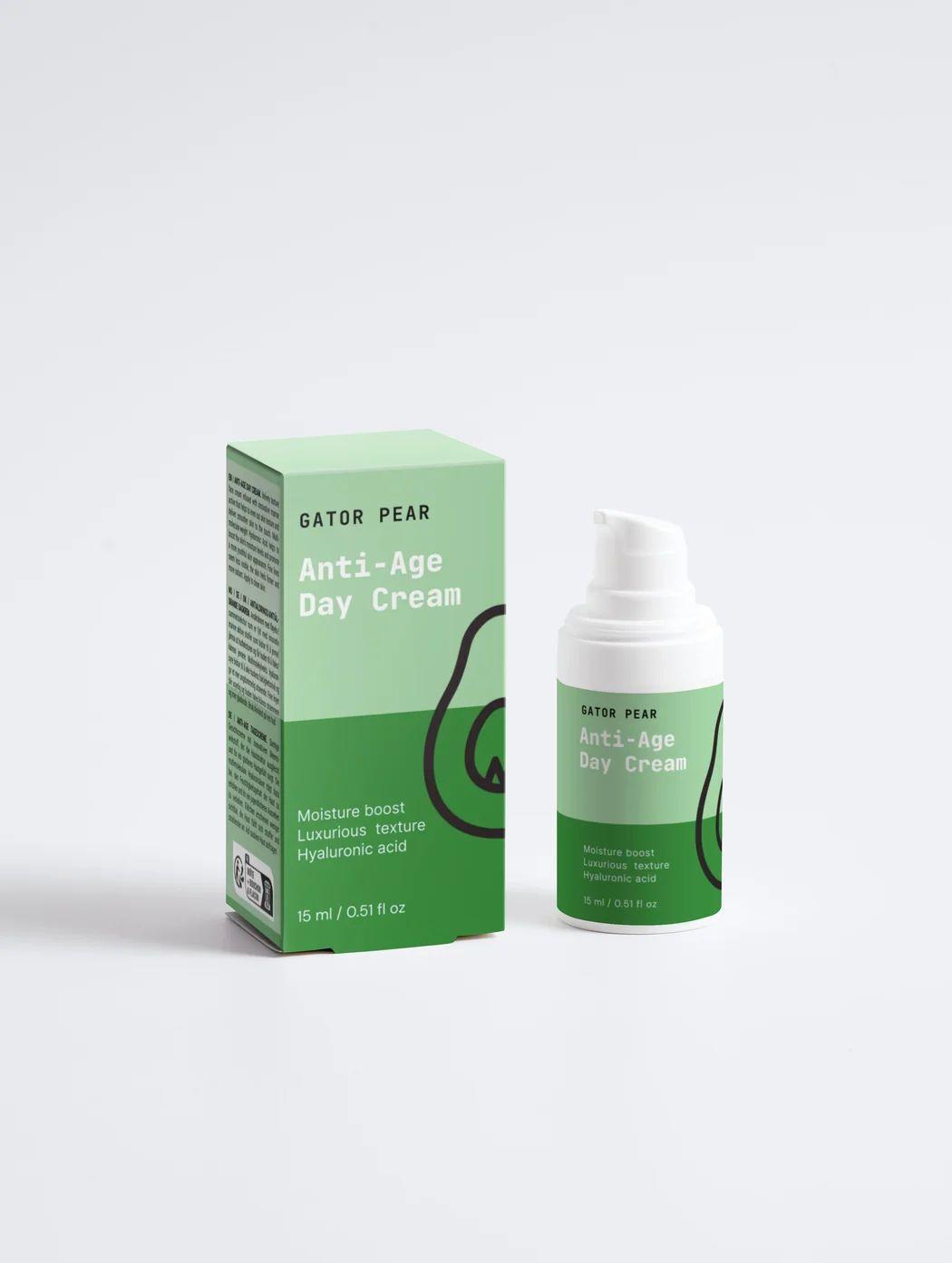 Green Gator Pear anti-age day cream bottle and matching cardboard box on a white studio background, minimalist skincare product photography.