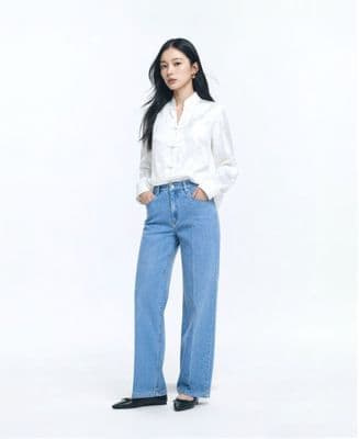 a woman standing with her hands in her pockets