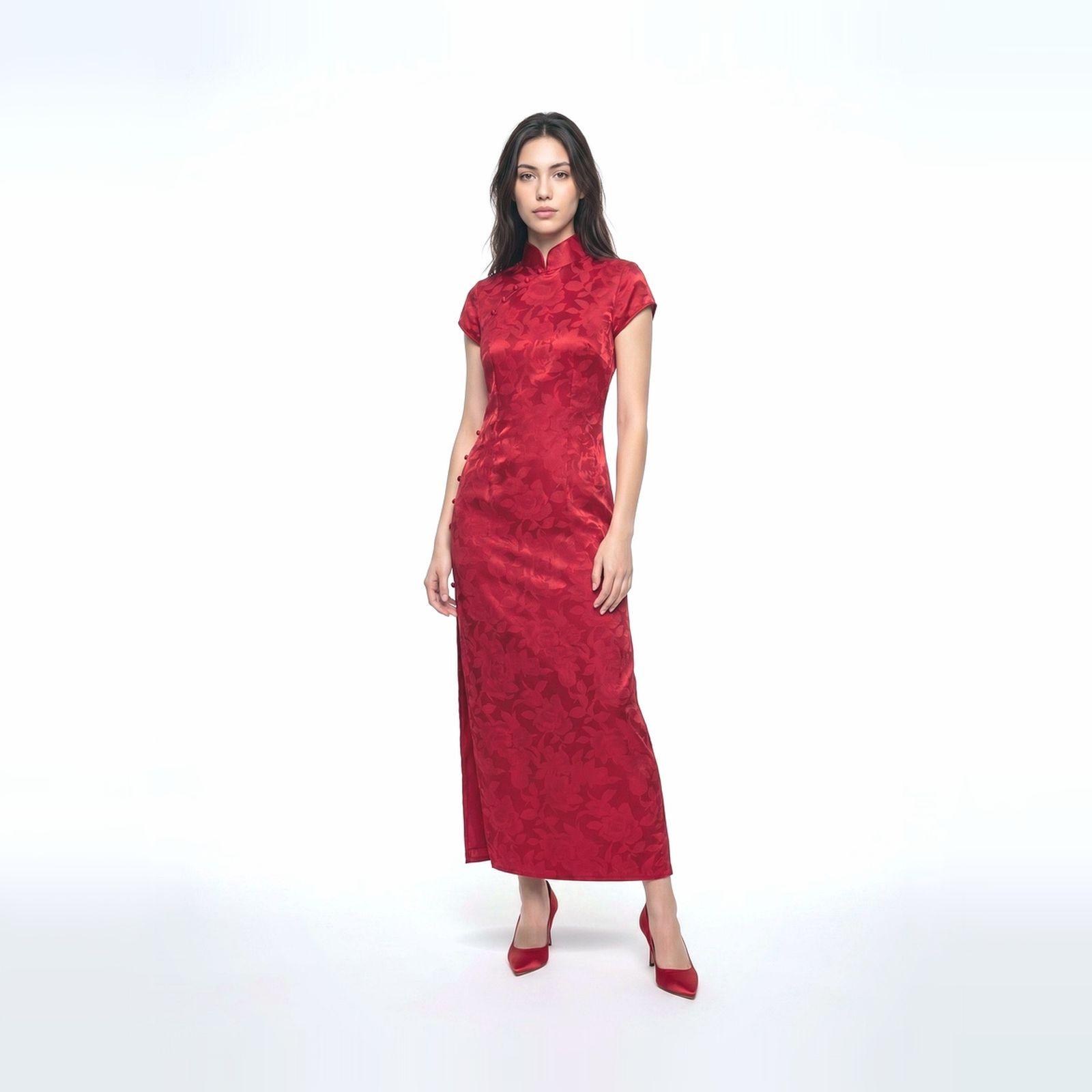 a woman in a red dress standing in front of a white background