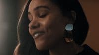 a close up of a person wearing earrings