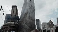 a very tall building towering over a city