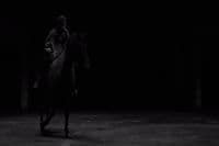 a man riding on the back of a horse