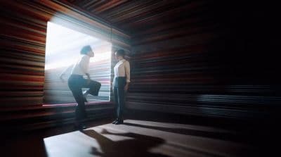 a couple of people standing in a room