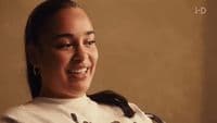 a woman with a smile on her face