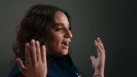 a woman with her hands in the air