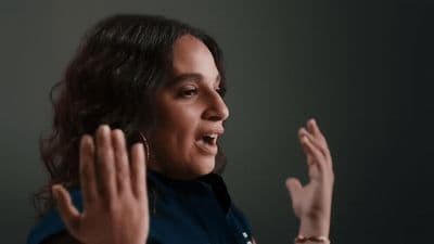 a woman with her hands in the air