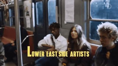 a group of people sitting on a train next to each other