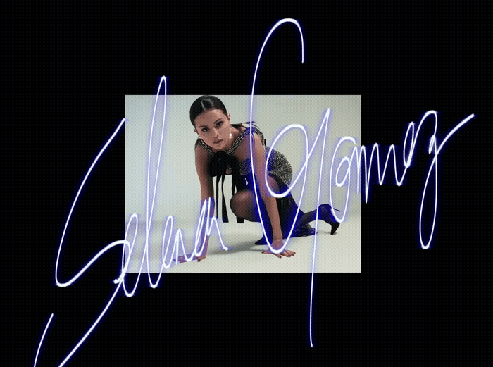a woman is posing for a picture with a neon light effect