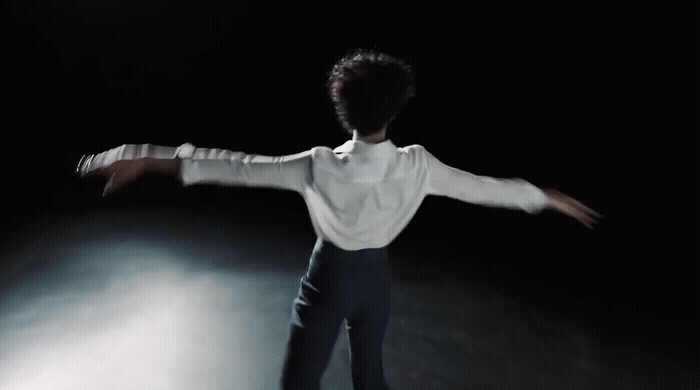 a man in a white shirt and black pants