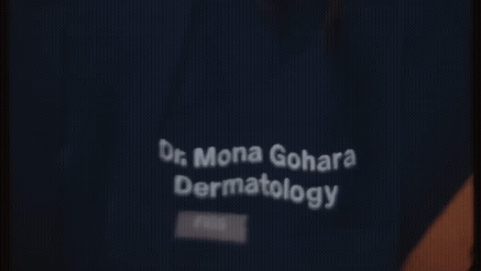 a close up of a person's shirt with the words dr mona gohar