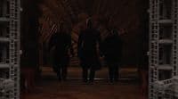 a group of people standing in front of a door
